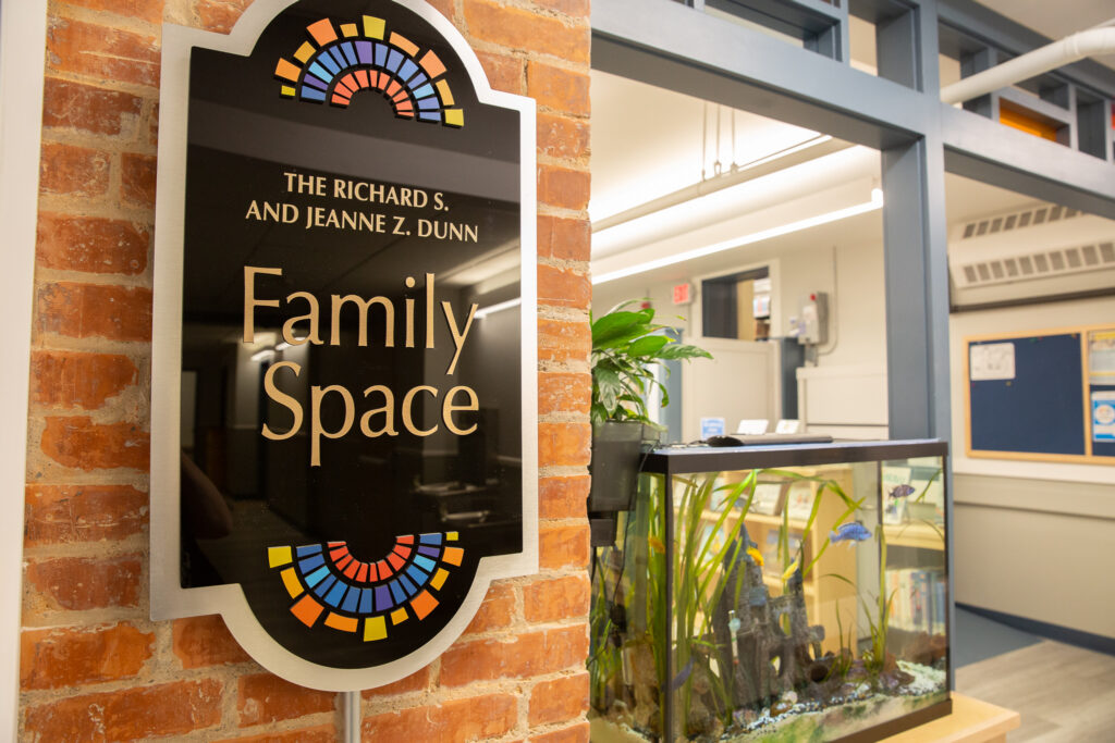 The Richard S. and Jeanne Z. Dunn Family Space at Seymour Library -- entrance with sign and fish tank