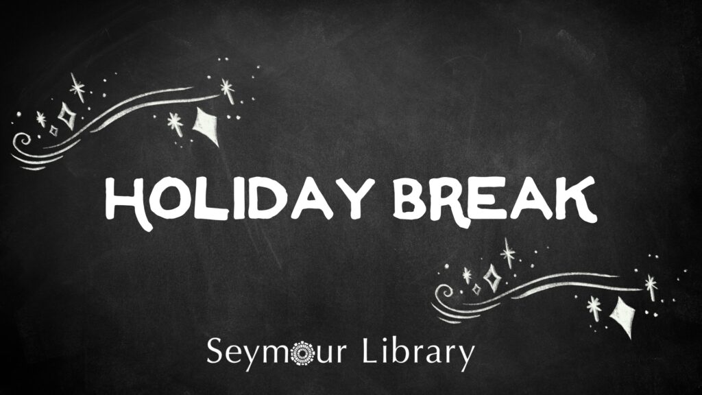 Holiday Break written on a chalkboard with the Seymour Library Logo and chalk stars and doodles.