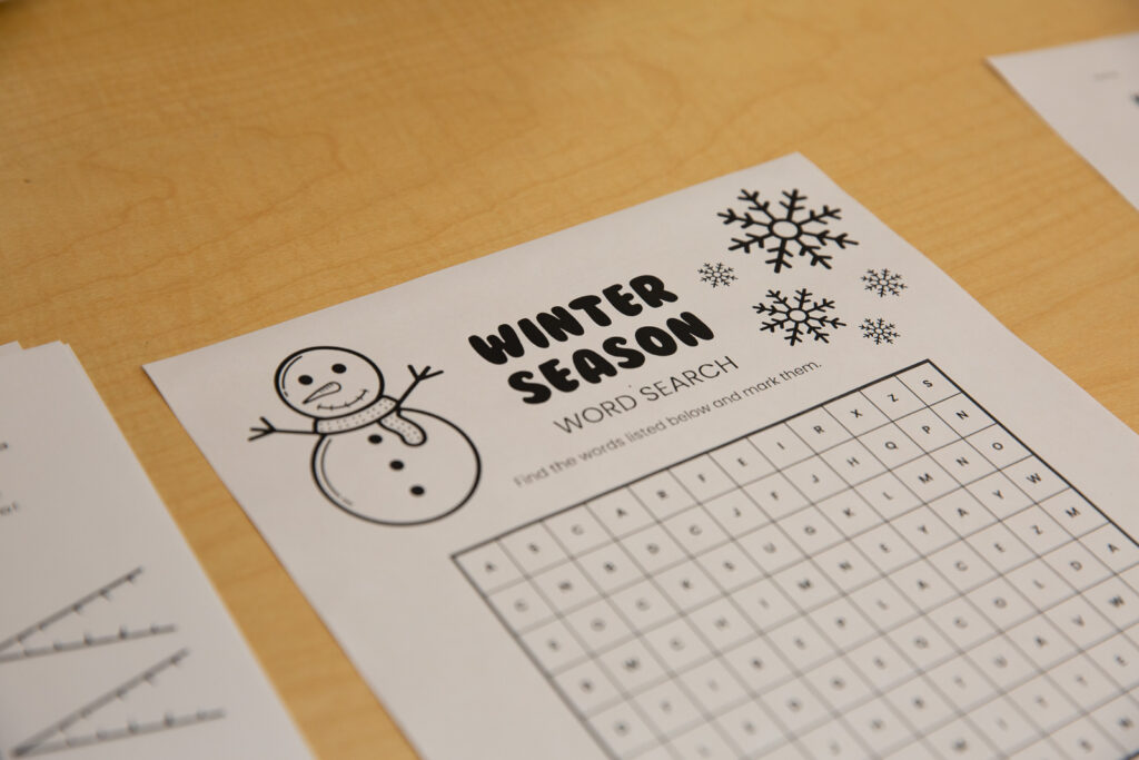Winter Break in Family Space - photo of activity sheet for children featuring a snowman and word search puzzle.